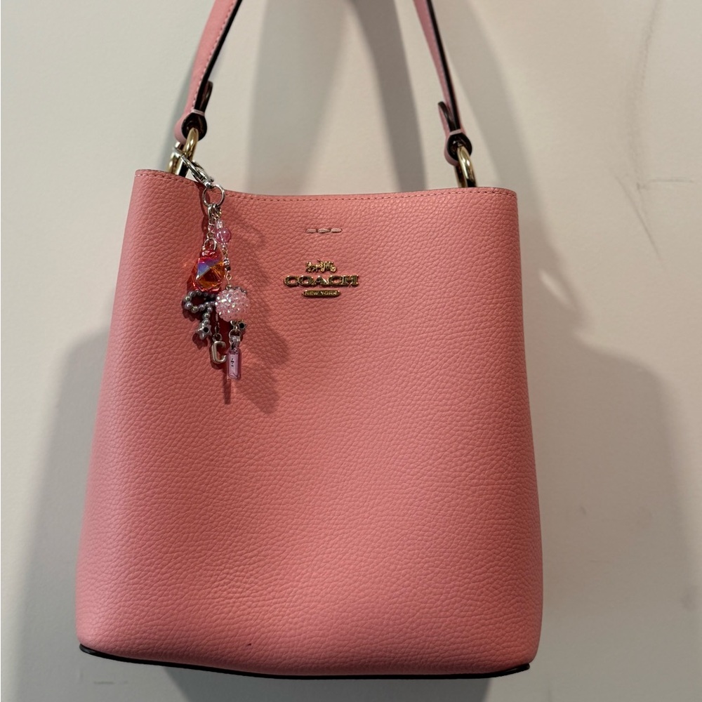 Pink Coach bucket bag crossbody strap included. Please review pictures